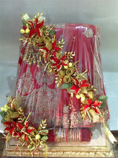 Maybe you would like to learn more about one of these? Lehenga for the bride... | Bridal gift wrapping ideas ...