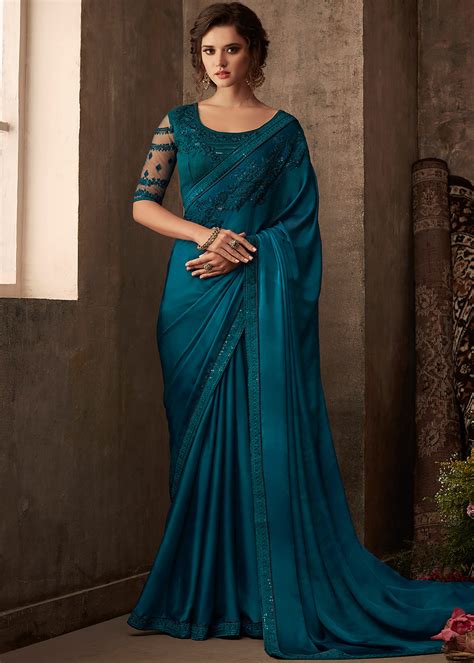 featuring a gorgeous blue saree in art silk designed with rich resham thread embroidery work