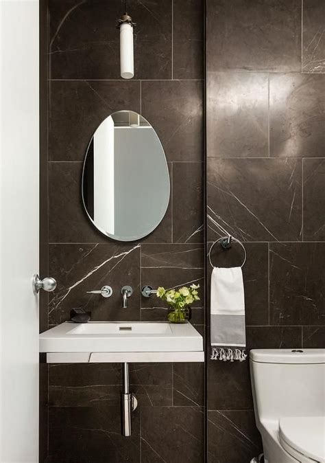 Chic Modern Powder Room Is Clad In Greystone Marble And