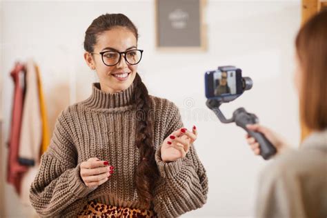 Smiling Young Woman Talking To Camera Stock Image Image Of Eyeglasses Camera 168042339
