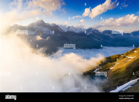 Fog Covering The Valley At Feet Of Majestic Galenstock Mountain Furka