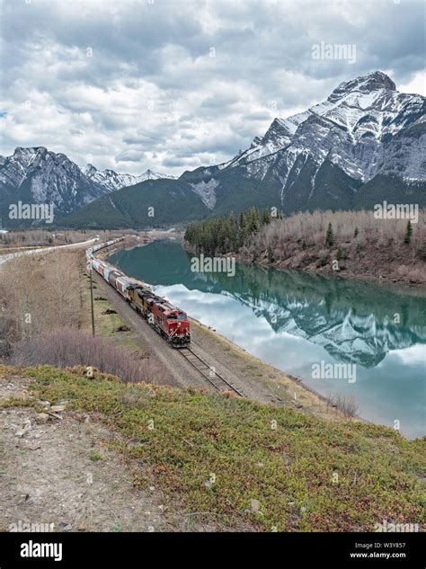 Aerial View Of A Freight Train Beside The Bow River At Exshaw Alberta