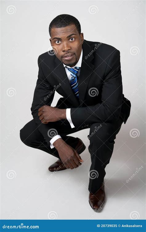 Business Man In Black Suit Squatting Stock Image Image Of Director