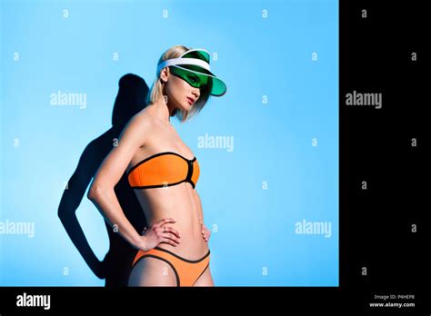Attractive Slim Model Posing In Bikini On Blue Stock Photo Alamy