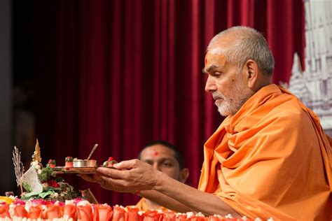 So, we could enjoy our tea, snacks. Swamishri offers thal to Shri Harikrishna Maharaj in 2020 ...