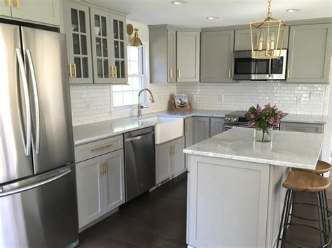 Grey and white kitchen small shaker cabinets. Gray kitchen features gray shaker cabinets adorned with ...