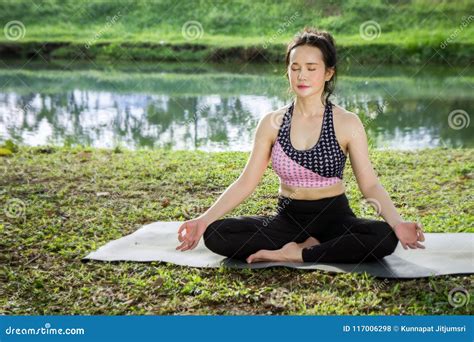 Young Woman Practicing Yoga To Strengthen The Shape Of Meditation