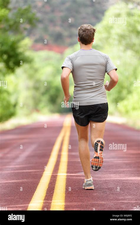 Running Man Runner Working Out For Fitness Male Athlete On Jogging Run