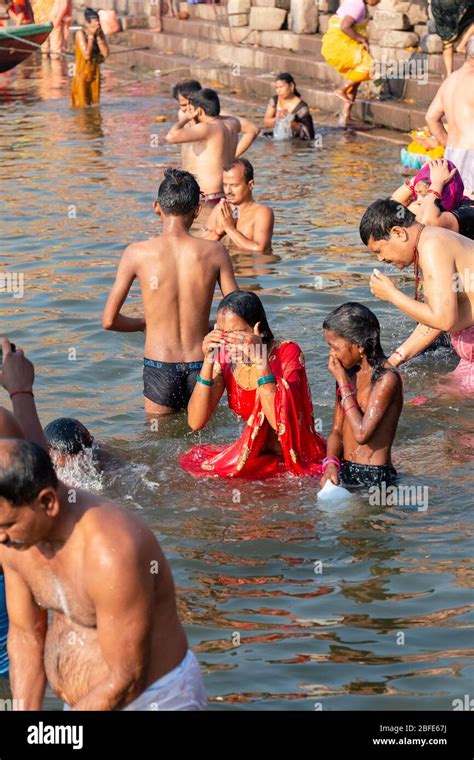 Pilgrims Bathing In Holy Ganges River At Sunrise In Varanasi India Stock Photo Alamy