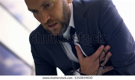 Anxious Business Man Feeling Chest Pain Stock Photo Edit Now 1250834830
