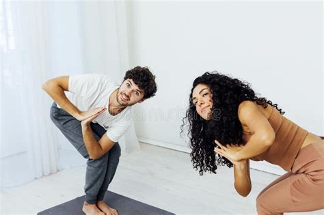 Man And Woman Engaged In Yoga Asana Sports Gymnastics Fitness Stock
