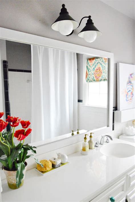 Framed bathroom mirrors look fabulous in the bathroom. 10+ DIY ideas for how to frame that basic bathroom mirror