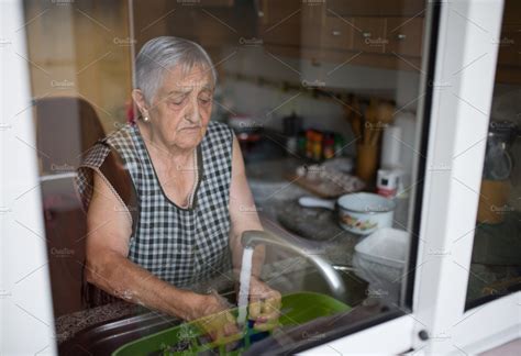 Elderly Woman Washing Dishes Containing Kitchen Elderly And Dishes High Quality People