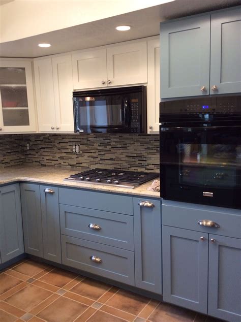 Also, cabinet hardware is nickel and also the countertops are a grey silestone with some blue flecks in it. Custom kitchen with white upper cabinets and French blue lower cabinets. Granite top with glass ...