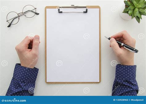 Clipboard With Attached Blank White Sheet Man Hands Holds Pen On White