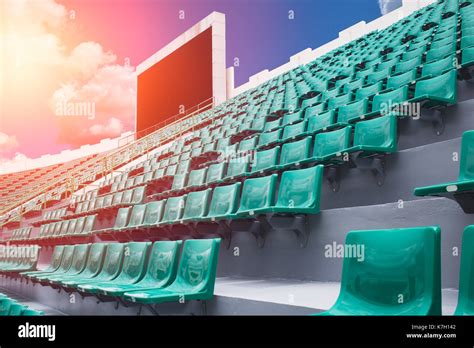 Sport Stadium Seat With Scoreboard In Day Summer Season Sky Background