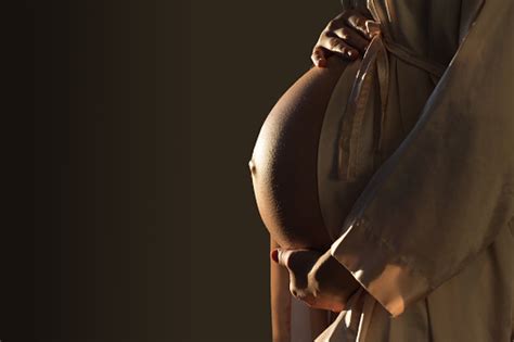 Beautifil Silhouette Of A Pregnant Woman With Highlight On Belly Stock