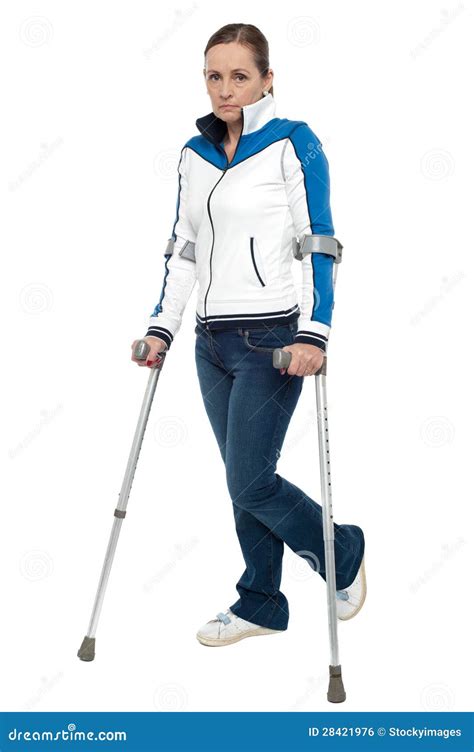 Pensive Looking Woman Using Crutches To Walk Stock Photo Image Of