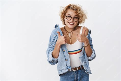 Free Photo Man In Glasses With Curly Short Blond Hairstyle Smiling Cheerful Showing Thumbs Up