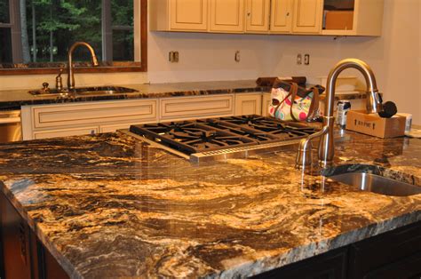 Magma Gold Granite With Lots Of Movement There Are Bits Of Black Grey