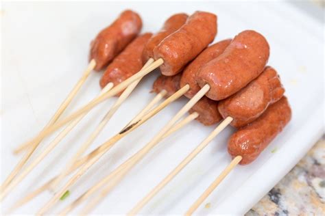 Skewered Hot Dogs The First Step In Making Gourmet Corn Dogs Flag