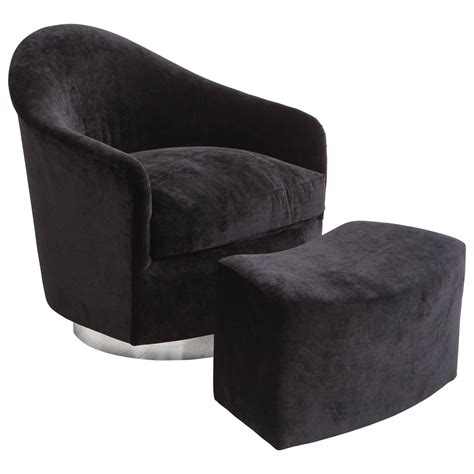 This swivel lounge chair with an ottoman adds contemporary elegance and comfort to your room. Milo Baughman, Black Velvet Swivel Chair and Ottoman, USA ...