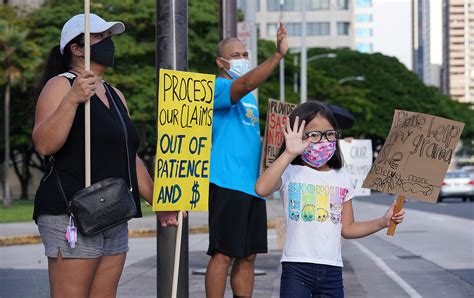 If you don't meet them, you may be denied benefits. Unemployment protest Aria Tatom grandma sign - Honolulu Civil Beat