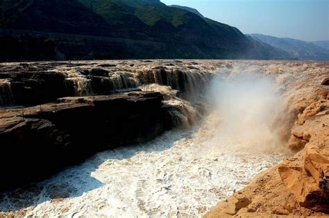 Hukou Waterfall The Yellow Waterfall In China Lazy Penguins