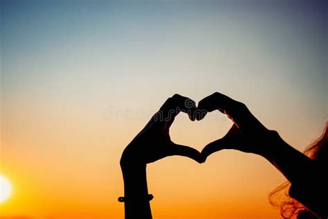 Silhouette Hands Forming Heart Shape With Sunset Stock Photo Image Of