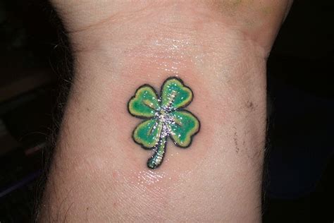 If a shamrock without its gorgeous green color just doesn't feel right to you, but you do want to stick in the micro category, check out these designs for a teensy bit of inspiration. Clover Tattoos - Page 2