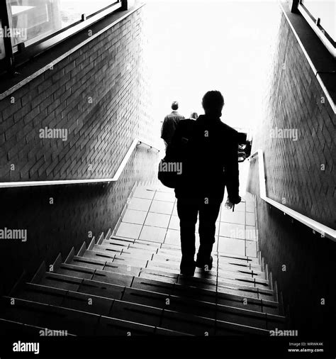 People Walking Down Stairs Stock Photo Alamy