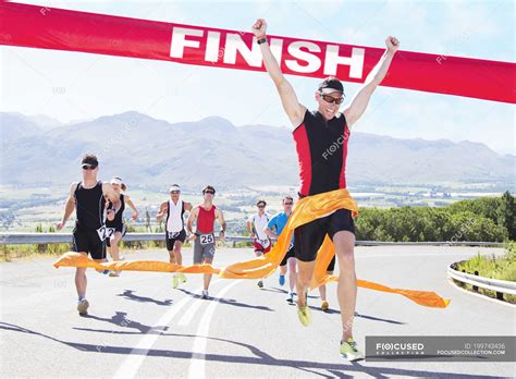 Runner Crossing Race Finish Line — People Success Stock Photo