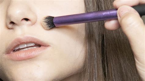 Why You Should Apply Setting Powder With A Small Makeup Brush Allure