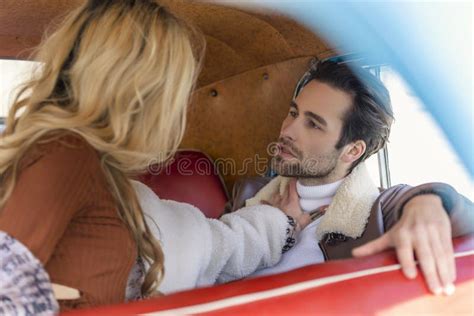 Couple Sitting In The Back Seat Of A Car Stock Image Image Of Calm