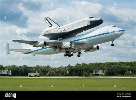 The Nasa Space Shuttle Enterprise Mounted Atop A Nasa 747 Shuttle
