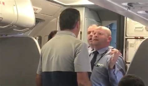 video shows american airlines flight attendant telling passenger ‘hit me after taking stroller