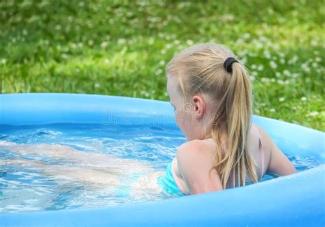 Little Blonde Girl Playing In Outdoor Swimming Pool On Hot Summer Day Stock Image Image Of
