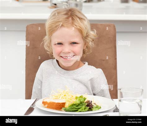 Cute Little Boy Eating Pasta And Salad Stock Photo Alamy