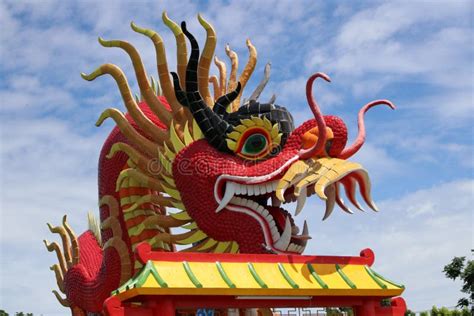 Red Dragon Head With Curly Mustache Over The Roof Stock Image Image