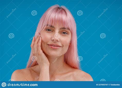 Portrait Of Beautiful Young Woman With Pink Hair And Perfect Skin Looking At Camera Posing