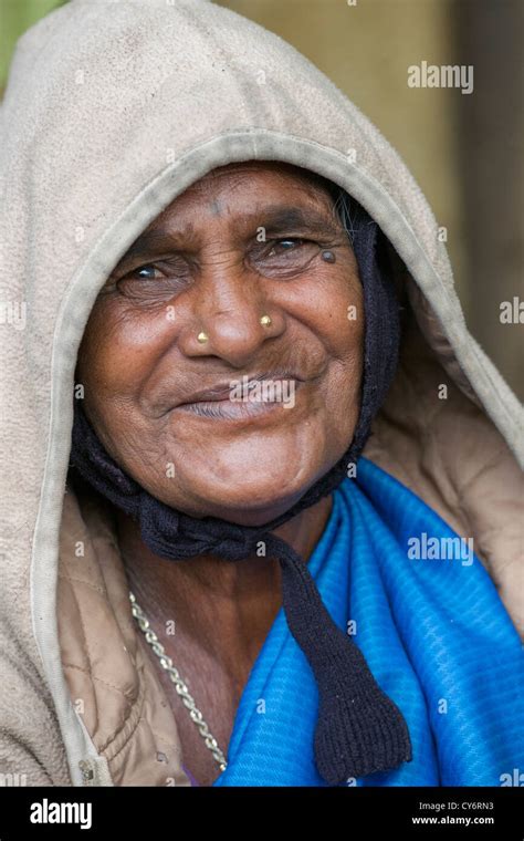 Portrait Of An Old Toothless Woman Smiling At A Foodstall Near Munnar