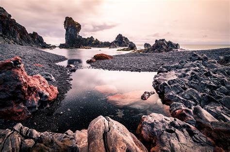 Gray Stones And Body Of Water Under White Cloudy Sky Iceland Hd