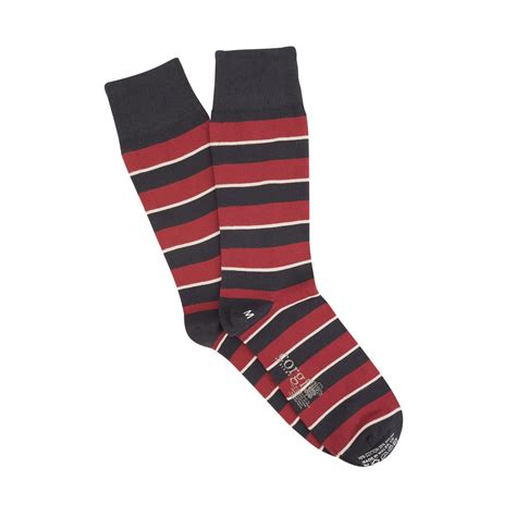 A Red Black And White Striped Sock Inspired By The Queens Dragoon