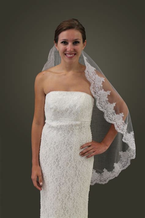 This White Luxurious Mantilla Wedding Veil By Tion Designit Features