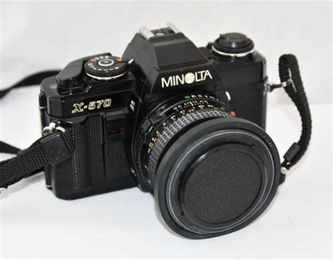 Minolta X 570 35mm Slr Film Camera Wmd 50mm F17 Lens And Haze 49mm Uv