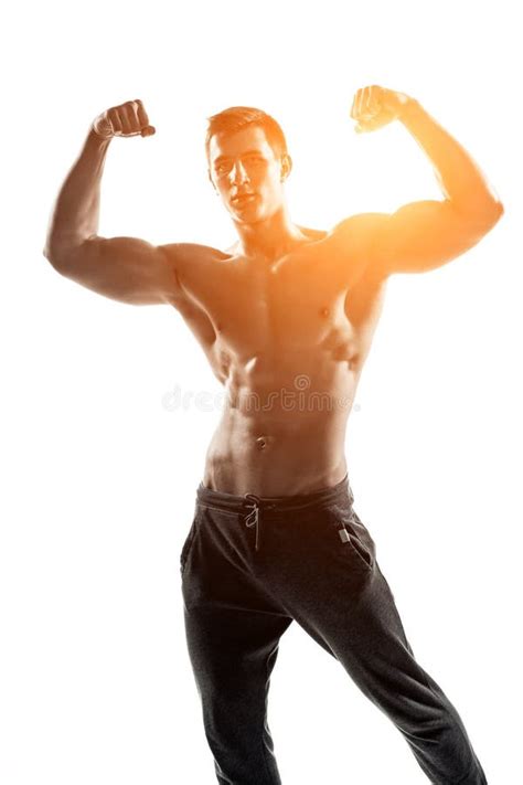 Muscular Man Posing Flexing His Biceps Showing Perfect Body Stock