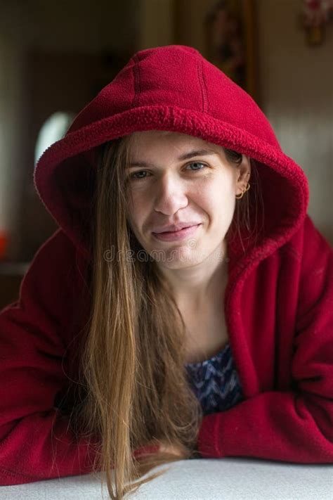 Young Beautiful Woman In A Red Jacket With Hooded Stock Photo Image