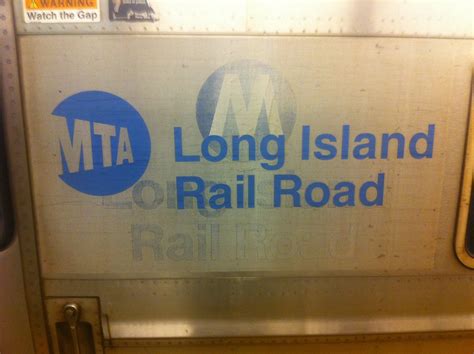 old mta logo haunts the side of an lirr train rolando pujol flickr