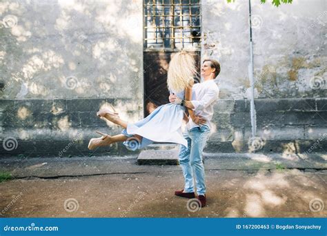 Stylish Hipster Couple Dancing In The Street Of Paris Happy Man Swirling His Woman In Air