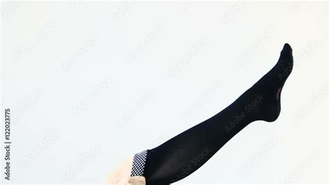 Woman Putting On Stocking Legs White Background Stock Video Adobe Stock